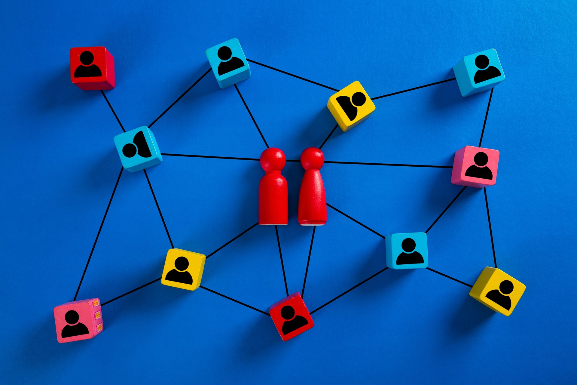 Wooden cube block print screen person icon which link connection network for organisation structure social network and teamwork concept.